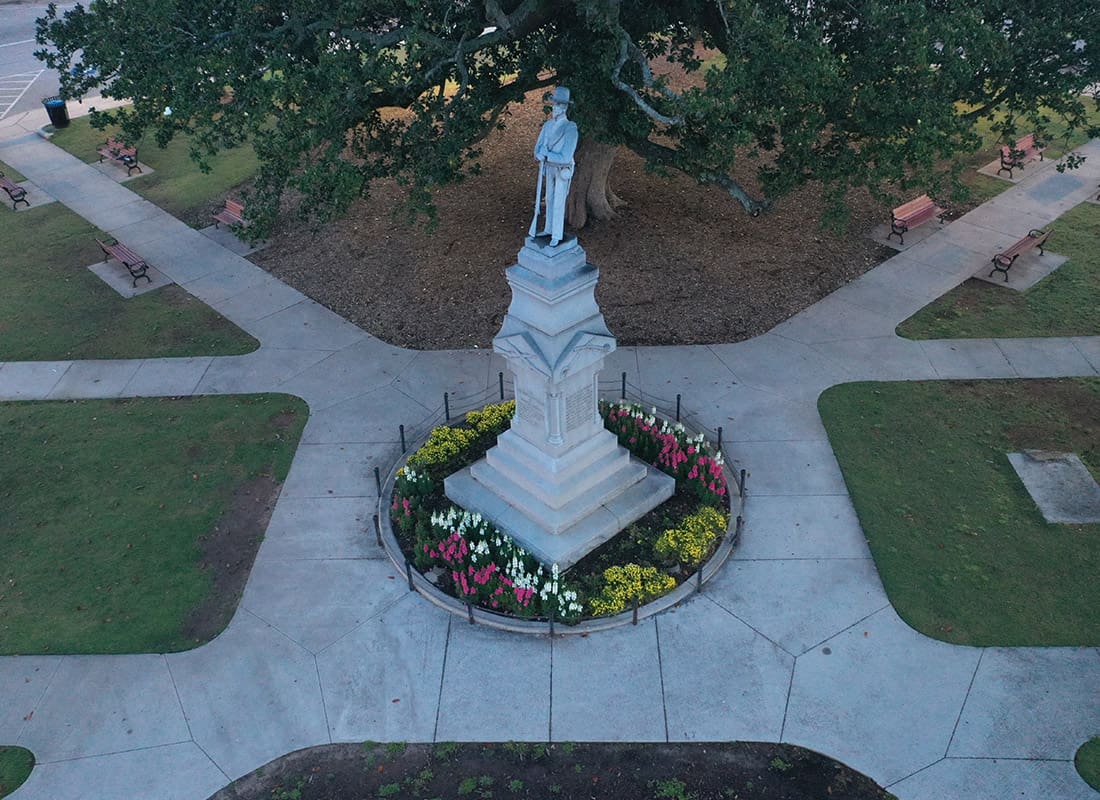 Covington, GA - Aerial View of Covington, GA With a Statue in a Park